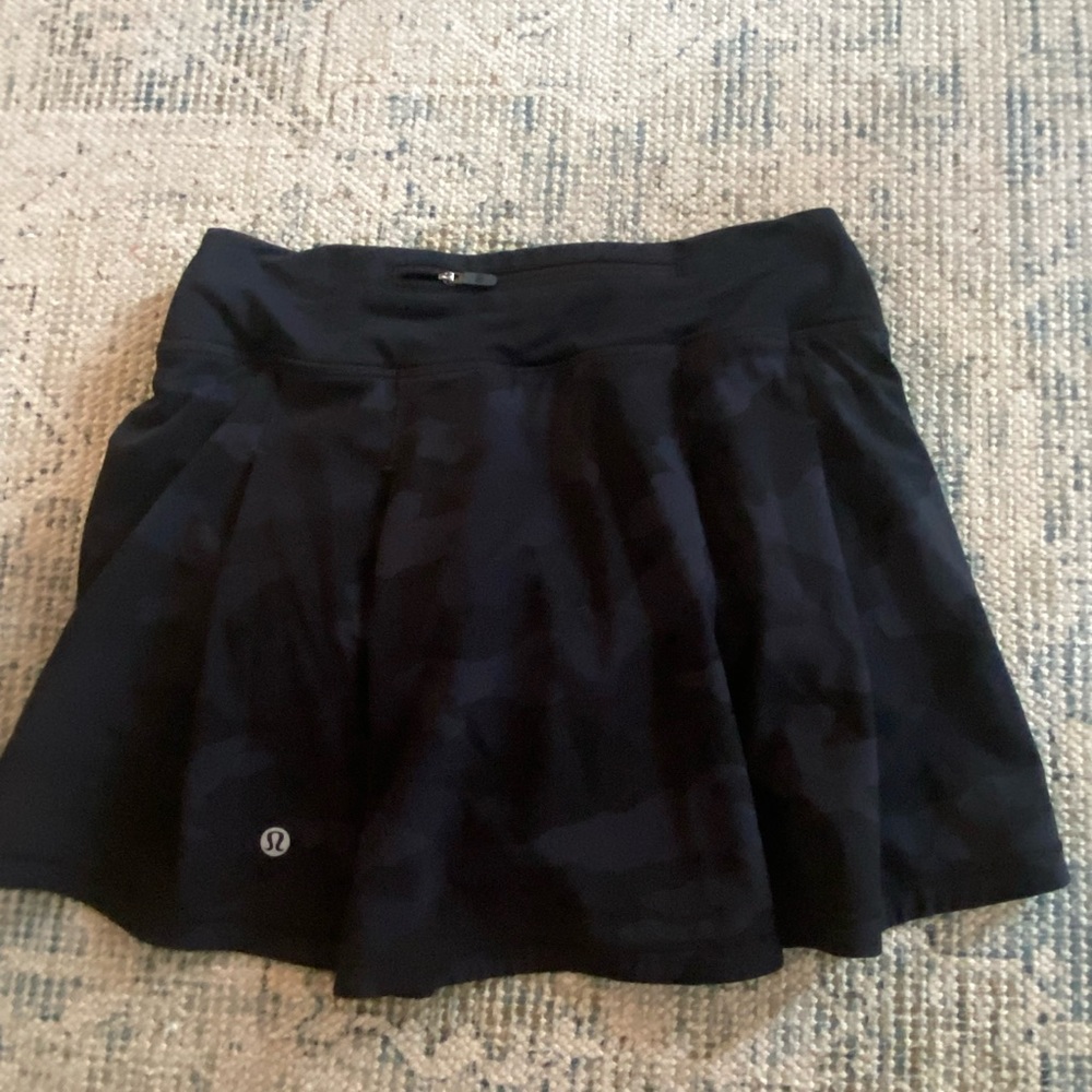 Size 2 Lululemon skirt with built in shorts. Color camo deep coal.